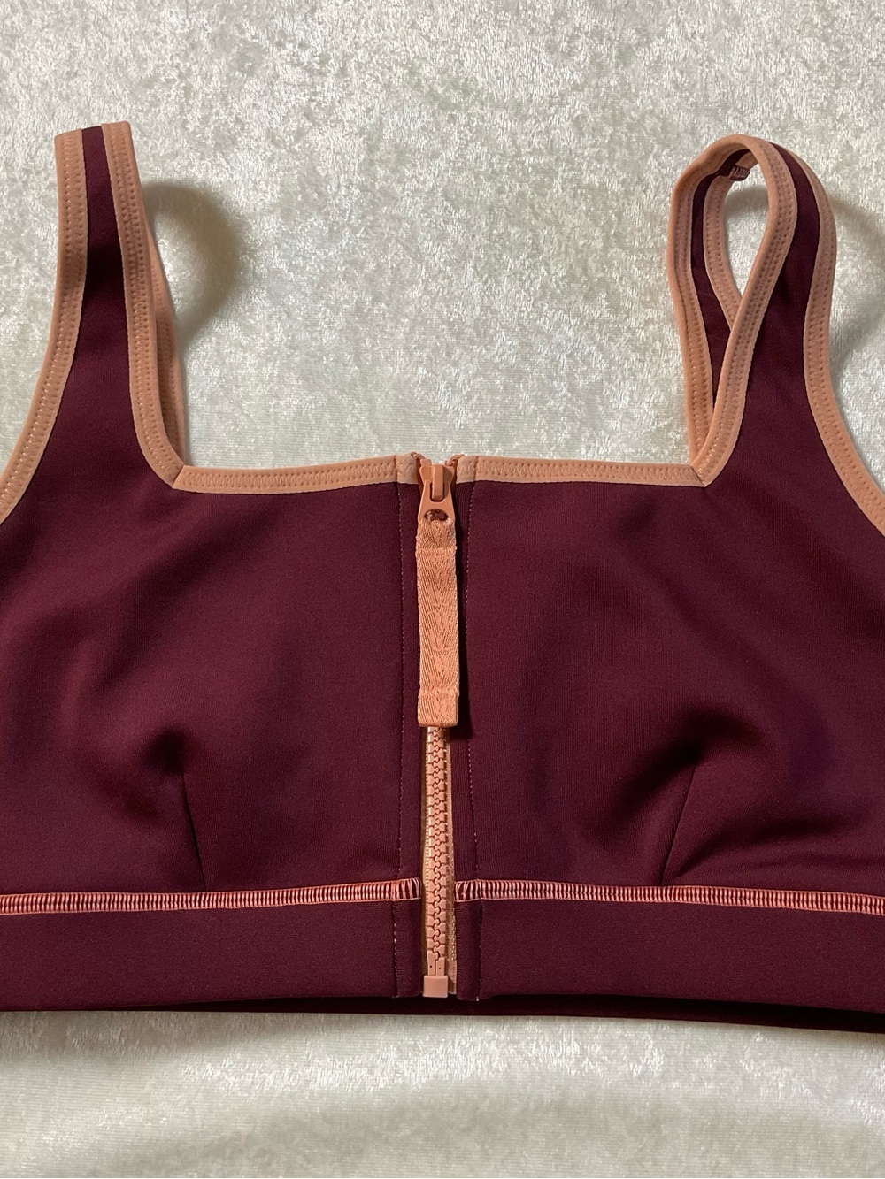 Fabletics Front-Zip Sports Bra in Burgundy with Peach Trim